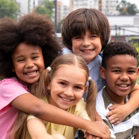 medium-shot-smiley-kids-posing-together-min